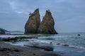 Sibling sea stacks wade in the Rialto Beach waters at Olympic National Park Royalty Free Stock Photo