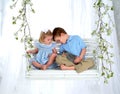 Siblings and Bunny on Swing Royalty Free Stock Photo