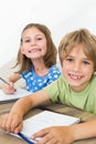 Siblings coloring at table Royalty Free Stock Photo