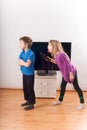 Siblings conflict over the remote control Royalty Free Stock Photo