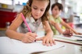 Siblings doing homework in kitchen Royalty Free Stock Photo