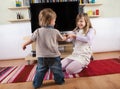 Siblings fighting over the remote control Royalty Free Stock Photo