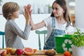 Siblings giving high five Royalty Free Stock Photo