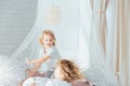 Siblings having pillow fight