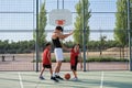 Siblings laughing and high fiving with their older brother, one of them has a leg prosthesis Royalty Free Stock Photo