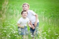 Siblings playing in field