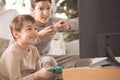 Siblings playing video games Royalty Free Stock Photo