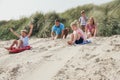 Siblings Racing Down the Sand Dunes