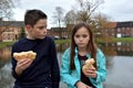 Siblings sharing pastry Royalty Free Stock Photo