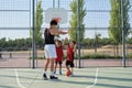 Siblings smile and high five with their older brother, one has a leg prosthesis. Royalty Free Stock Photo