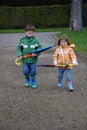 Brother and sister and big umbrellas Royalty Free Stock Photo