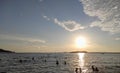 Sibolga , North Sumatra, Indonesia - January 11, 2022 : sunset on the Anggar beach and silhouettes of people on the beach Royalty Free Stock Photo