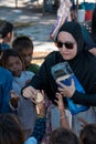 Sibuan, Malaysia - November 26, 2019: Visitors distributing snacks and goods to the Bajau Laut kids in their village