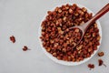 Sichuan pepper. Chinese pepper Zanthoxylum schinifolium in bowl, top view Royalty Free Stock Photo