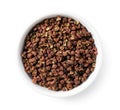 Sichuan pepper in a white bowl set against a white background Royalty Free Stock Photo