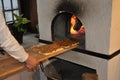 Italian food. Sicilian recipe. Traditional sfincione tomato pizza. Wood open fire oven.