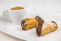 Sicilian Cannoli and coffee on white dish