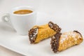 Sicilian Cannoli and coffee on white dish