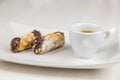 Sicilian Cannoli and coffee on white dish