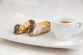 Sicilian Cannoli and coffee on white dish