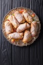 Sicilian cannoli stuffed with ricotta and candied fruits close-up on a plate. Vertical top view Royalty Free Stock Photo