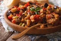 Sicilian Caponata with aubergines closeup on wooden plate. horiz Royalty Free Stock Photo