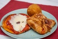 Sicilian Cartocciata, Pizzetta, Cipollina and Arancino. A typical street food from Sicily