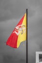 Sicilian Flag Waving in the Sky of Donnalucata, Scicli, Ragusa, Sicily, Italy Royalty Free Stock Photo