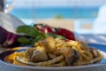 Sicilian pasta dish with traditional busiata pasta and sicilian vegetables, Viola eggplant, tomatoes served ourdoor on terrace Royalty Free Stock Photo