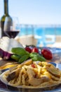 Sicilian pasta dish with traditional busiata pasta and sicilian vegetables, Viola eggplant, tomatoes served ourdoor on terrace Royalty Free Stock Photo