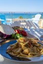 Sicilian pasta dish with traditional busiata pasta and sicilian vegetables, Viola eggplant, tomatoes served ourdoor on terrace Royalty Free Stock Photo