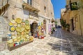 Sicilian souvenirs. Ancient, typical narrow and cobblestone street in Erice, Sicily, Italy.