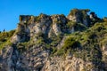 Sicilian stone houses on rocky shore of Ionian sea in Taormina over Giardini Naxos town in Messina region of Sicily in Italy Royalty Free Stock Photo