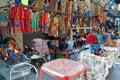 Sicily, Italy - June 22, 2022: A cloth street shop in the market of palermo with sellers looking at the camera Royalty Free Stock Photo