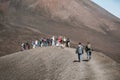 SICILY, ITALY - OCTOBER 1, 2018: People walking on the peak of Etna volcano. The biggest active mountain volcano in Europe