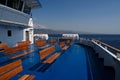 Sicily, Italy - 27.07.2024: Scenic ferry deck with empty benches overlooking the sea and distant horizon Royalty Free Stock Photo