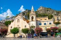 Sicily, Taormina, Italy - 28 September 2023. Tourists at Mainsquare Piazza IX Aprile and San Giuseppe church. City views, facades