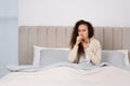 Sick African American woman in bed at home Royalty Free Stock Photo