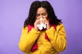 Sick African Woman Blowing Nose Sneezing In Tissue, Purple Background Royalty Free Stock Photo