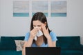 Sick allergic woman wiping running nose got flu virus coughing, seasonal allergy symptoms at workplace. Unhealthy female