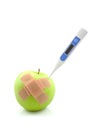 Sick apple with thermometer and patches