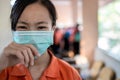 Sick asian child girl student wearing Thai school uniform with hygienic mask,health care,dust,air pollution,Pm2.5,virus protection Royalty Free Stock Photo