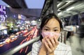 Sick asian people wearing protective mask,child girl has cough,choking on air pollution,problems of toxic dust,smog,fine dust,air Royalty Free Stock Photo