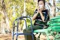 Sick asian senior woman sneezing in a tissue blowing her runny nose,female elderly suffer from allergic rhinitis,weather is Royalty Free Stock Photo