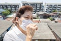 Sick asian senior woman wearing protective mask when having flu,fever,coughing to reduce the risk the spread of Coronavirus Royalty Free Stock Photo