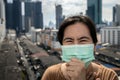 Sick asian woman had a cough,sore throat or symptoms of a cold flu,uncomfortable,people wearing medical protective mask in the Royalty Free Stock Photo