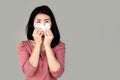 Sick Asian woman sneezing and coughing hand holding paper tissue covering her nose , suffer from flu and virus Royalty Free Stock Photo