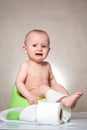 Sick baby constipation, colic, bloating, indigestion heartburn, digestion, pain, diarrhea. sitting on the potty with toilet paper