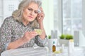 Close up portrait of sick beautiful senior woman with headache Royalty Free Stock Photo