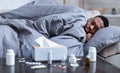 Sick Black Guy Having Chills Lying On Couch At Home